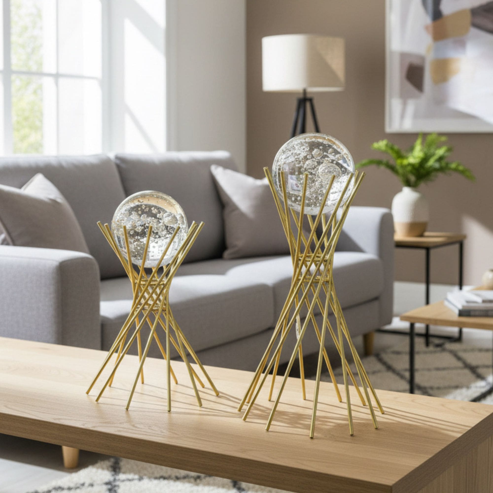 Two piece metal crystal decor set on wooden table